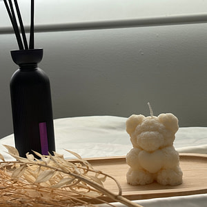 Bougie teddy en forme d'ourson blanc