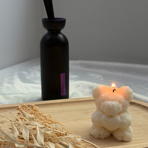Bougie teddy en forme d'ourson blanc